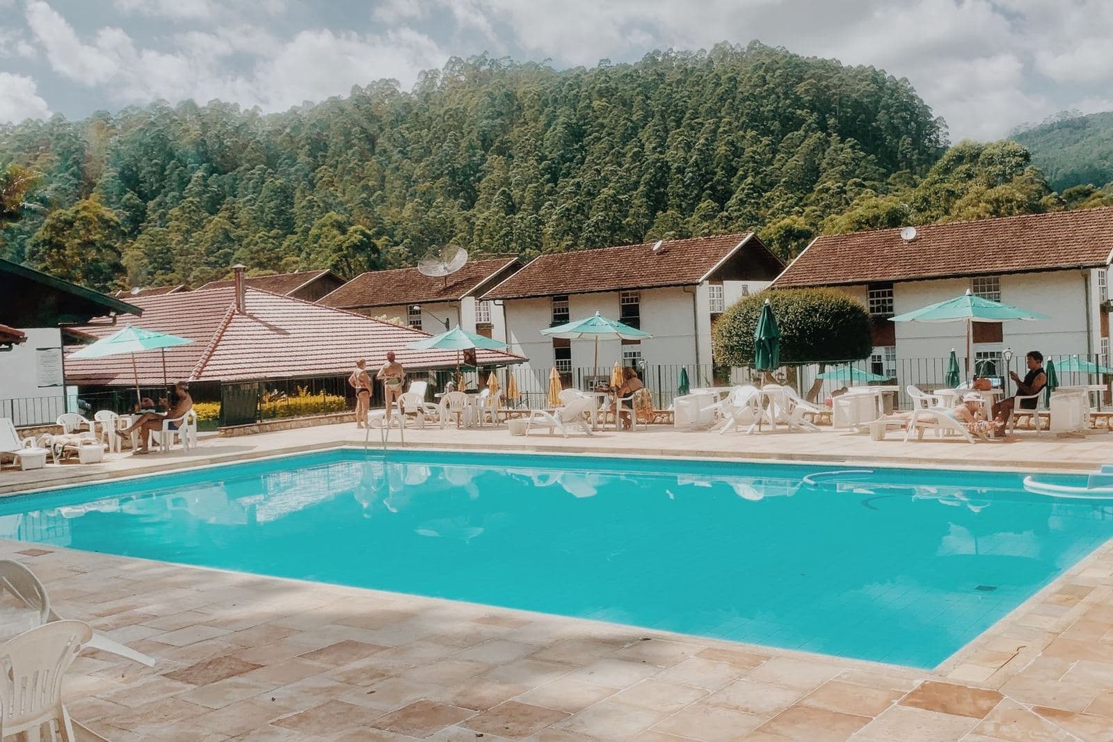 Swimming pool with loungers