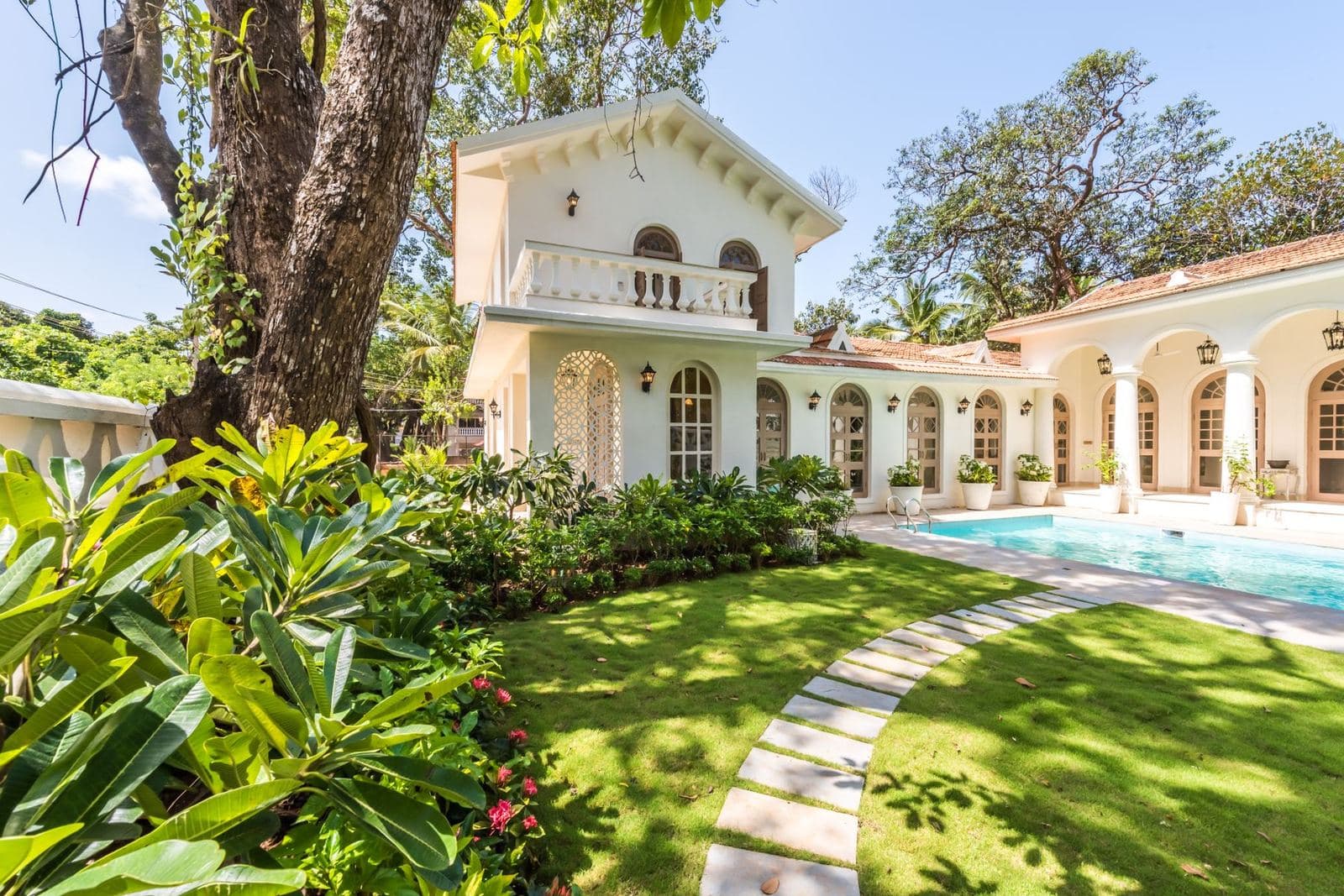 A villa with a private pool and garden